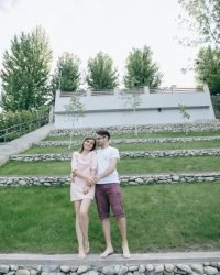 Weeding couple standing holding hands garden